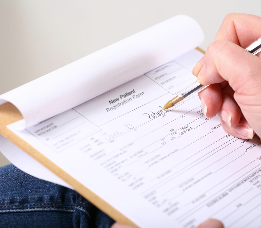 Completing new patient paperwork