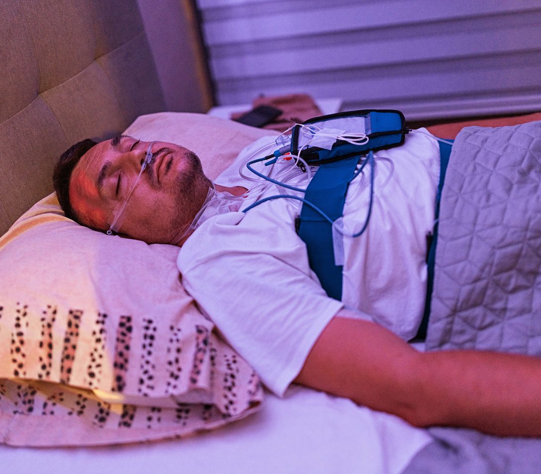Man undergoing sleep study at home