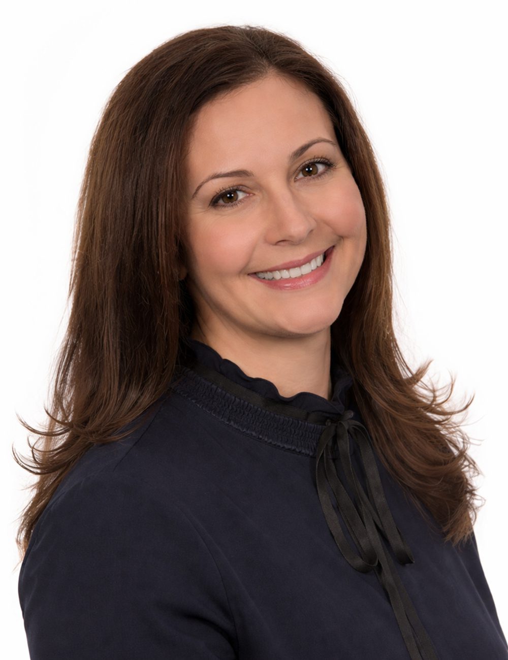 Woman in dark blouse smiling